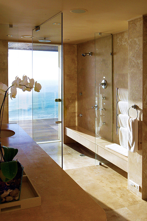 Travertine-bathroom-with-ocean-view-at-Ellerman-Villa-h